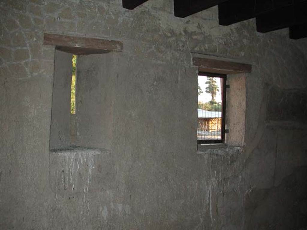 III.10, Herculaneum. September 2003.  
Looking towards east wall with windows, of room positioned above the cubiculum and entrance corridor of the Casa del Tramezzo di legno 
Photo courtesy of Nicolas Monteix.